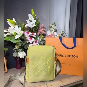 This is an authentic Louis Vuitton Damier Geant LV Cup Weatherly Crossbody Bag.
